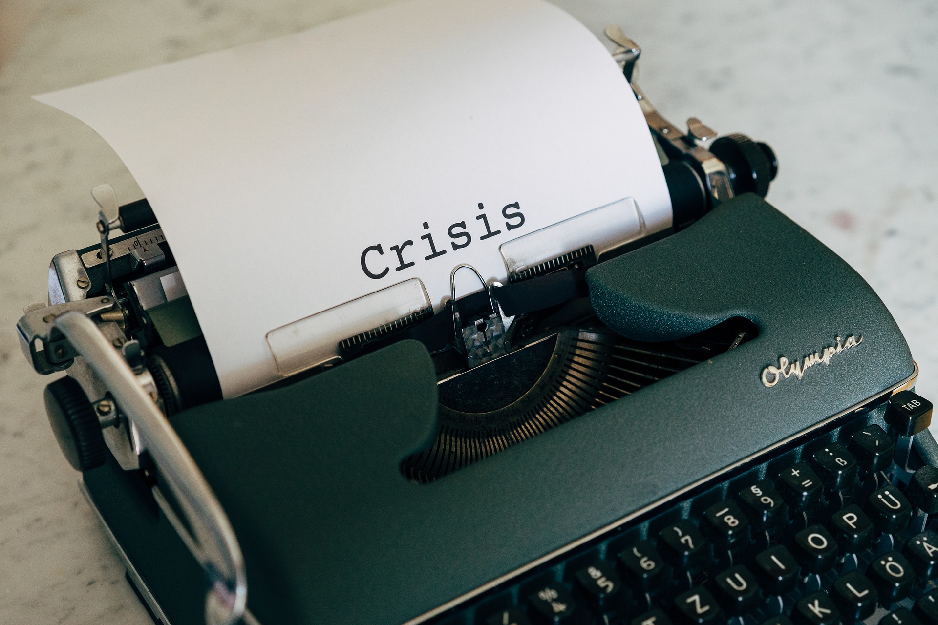 Crisis wrote on typewriter